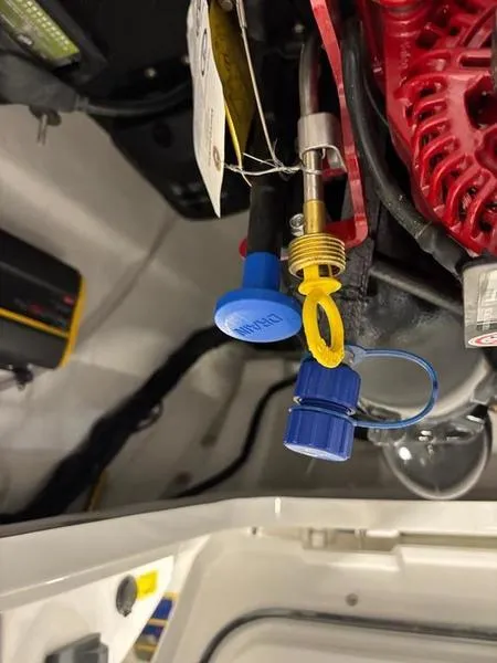 Slide: The Image of Close-up of Cobalt R31 2025 engine components with blue and yellow caps. - 38