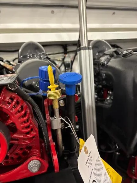 Slide: The Image of Close-up of a 2025 Cobalt R31 engine with red and blue components. - 41