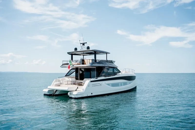 Slide: The Image of Luxury Prestige M7 yacht on serene ocean, 2025 model, under clear blue sky. - 22