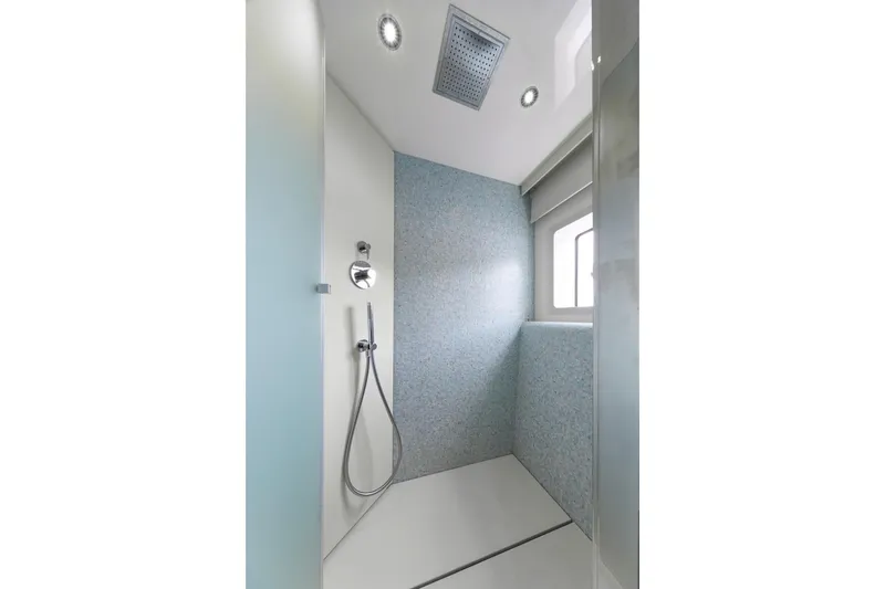 Slide: The Image of Modern shower area in Prestige M7, 2025 model, featuring sleek design and overhead lighting. - 39