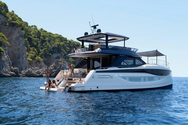 Slide: The Image of Luxurious 2025 Prestige M7 yacht cruising near scenic rocky coastline. - 105