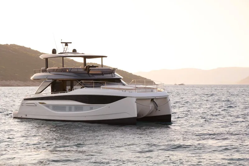 Slide: The Image of Luxury Prestige M7 yacht cruising on serene waters at sunset, 2025 model. - 108