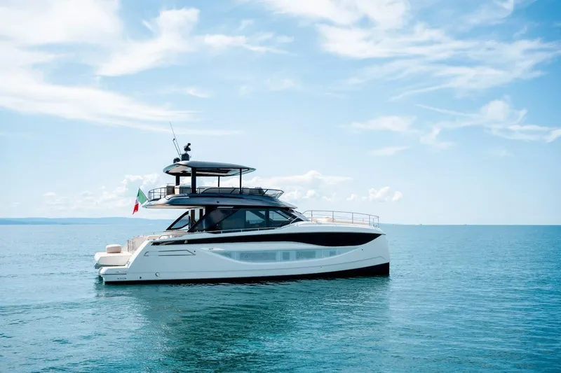 Slide: The Image of Luxury Prestige M7 yacht cruising on open sea, 2025 model, under clear blue sky. - 15