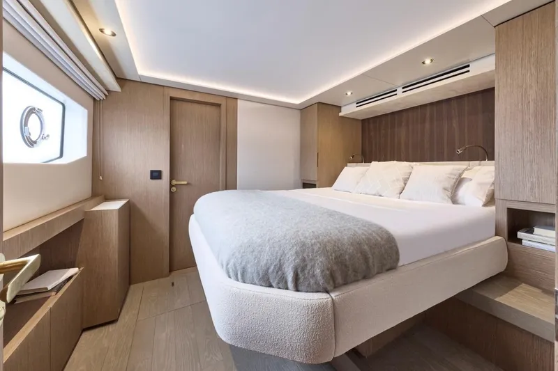 Slide: The Image of Luxurious bedroom interior of 2025 Prestige M7 yacht with modern design and cozy ambiance. - 39