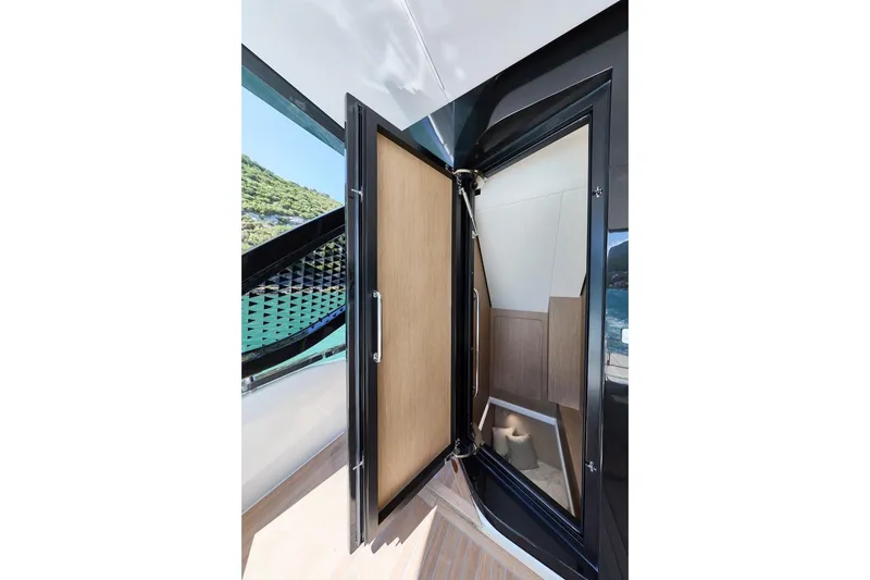 Slide: The Image of Luxury yacht interior door on Prestige M7, 2025 model, with sleek design and ocean view. - 43