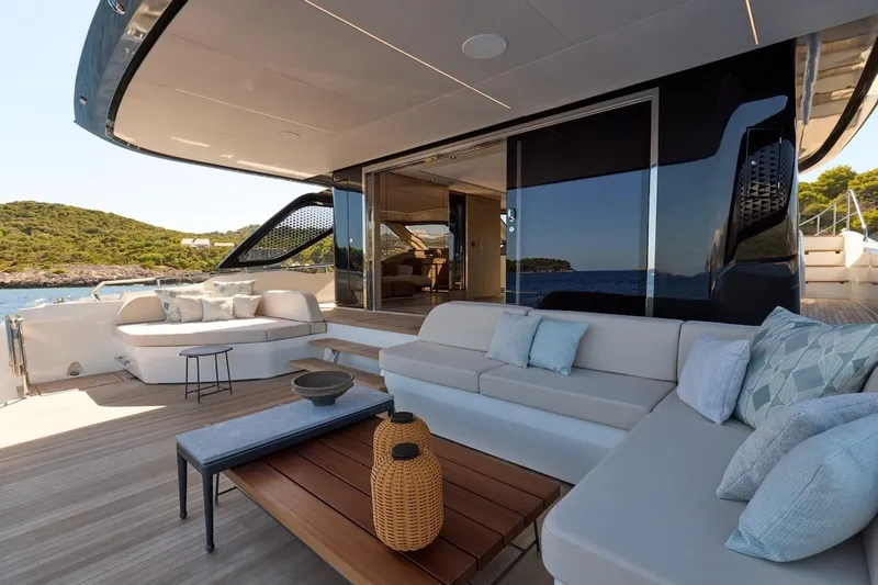 Slide: The Image of Luxurious 2025 Prestige M7 yacht deck with elegant seating and scenic ocean view. - 57