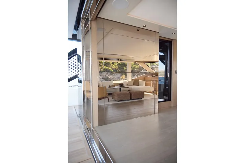 Slide: The Image of Luxurious interior of 2025 Prestige M7 yacht with modern furnishings and scenic views. - 58