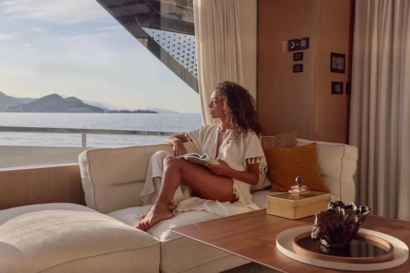 Slide: The Image of Woman relaxing on a Prestige M7 yacht, enjoying ocean views, 2025 model. - 71