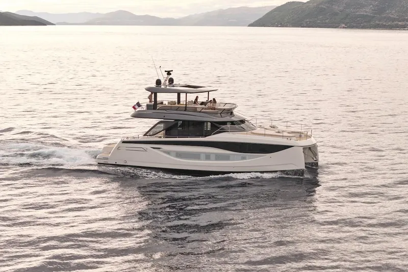 Slide: The Image of Luxury Prestige M7 yacht cruising on serene waters, 2025 model. - 87