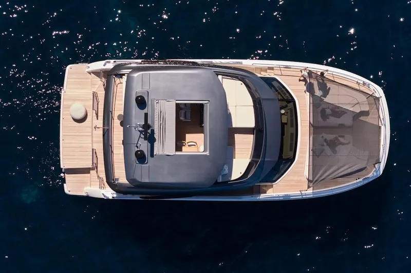 Slide: The Image of Top view of 2025 Prestige M7 yacht on deep blue water. - 99