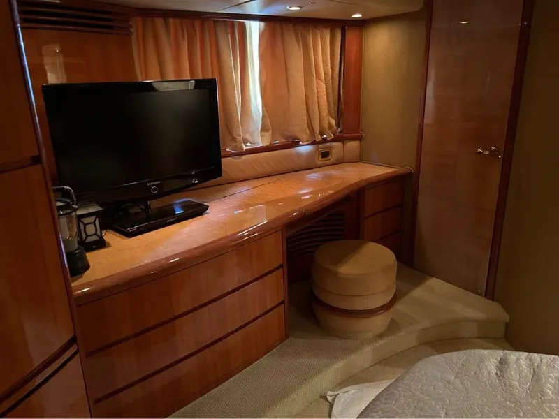 Slide: The Image of Luxurious interior of a 2006 Azimut 62 yacht with TV and elegant wood finish. - 12