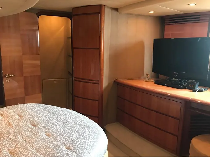 Slide: The Image of Luxurious interior of a 2006 Azimut 62 yacht with wood paneling and modern amenities. - 13
