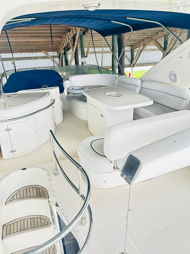 Slide: The Image of Luxurious 2006 Azimut 62 yacht interior with elegant seating and dining area. - 31