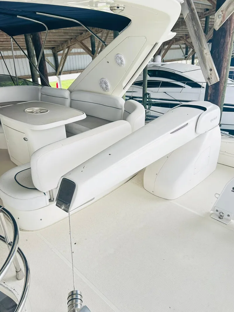 Slide: The Image of Luxury Azimut 62 yacht interior, 2006 model, featuring elegant white seating and modern design. - 32