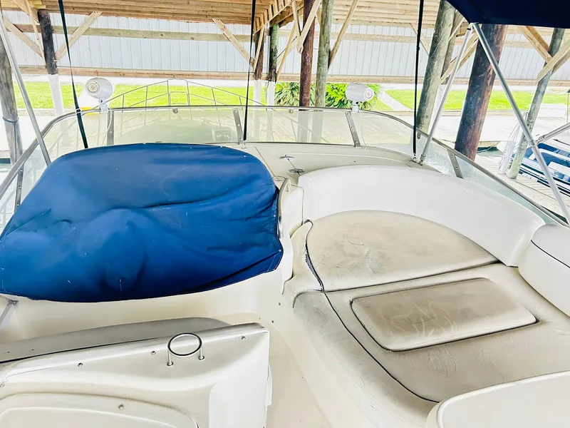 Slide: The Image of 2006 Azimut 62 yacht interior with blue cover and white seating under a wooden canopy. - 35