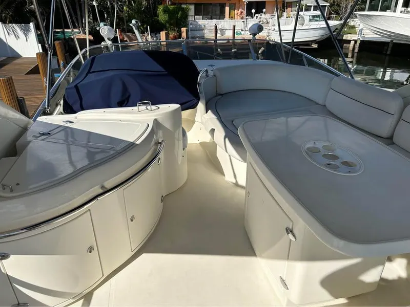 Slide: The Image of Luxurious 2006 Azimut 62 yacht deck with seating and storage, docked at marina. - 4