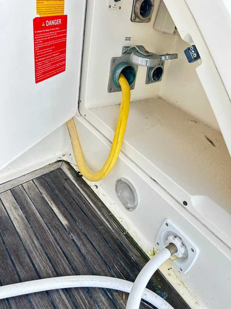 Slide: The Image of Azimut 62 yacht power connections, 2006 model, featuring yellow and white cables. - 44
