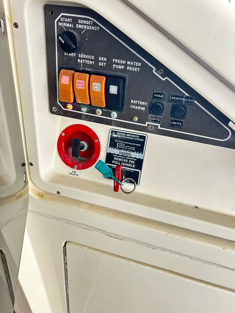 Slide: The Image of Control panel of a 2006 Azimut 62 yacht with switches and key. - 45