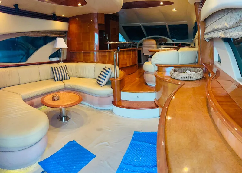 Slide: The Image of Luxurious interior of a 2006 Azimut 62 yacht with elegant seating and wooden finishes. - 48