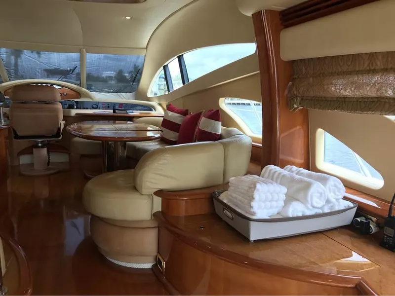 Slide: The Image of Luxurious interior of a 2006 Azimut 62 yacht with plush seating and elegant decor. - 8