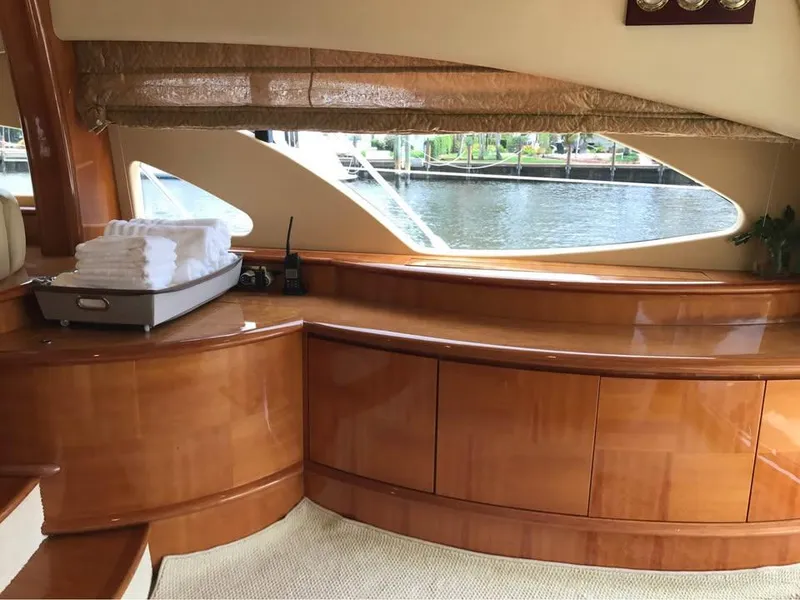 Slide: The Image of Luxurious interior of a 2006 Azimut 62 yacht with polished wood finish. - 9