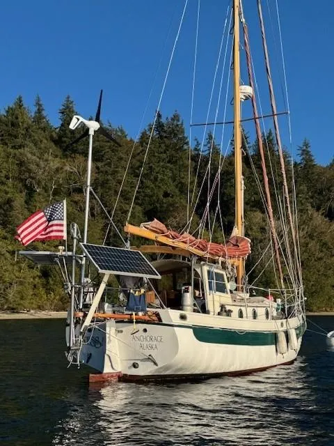Slide: The Image of 1985 Bristol Channel Cutter 28 sailboat on stands, undergoing maintenance. - 11