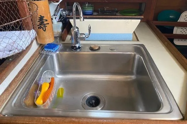 Slide: The Image of Stainless steel sink in 1985 Bristol Channel Cutter 28 boat galley. - 23