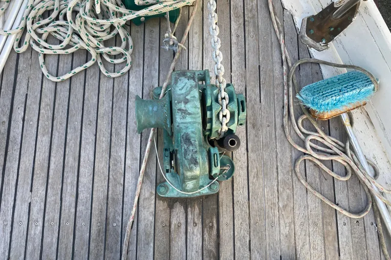 Slide: The Image of Deck of 1985 Bristol Channel Cutter 28 with winch, ropes, and cleaning brush. - 36