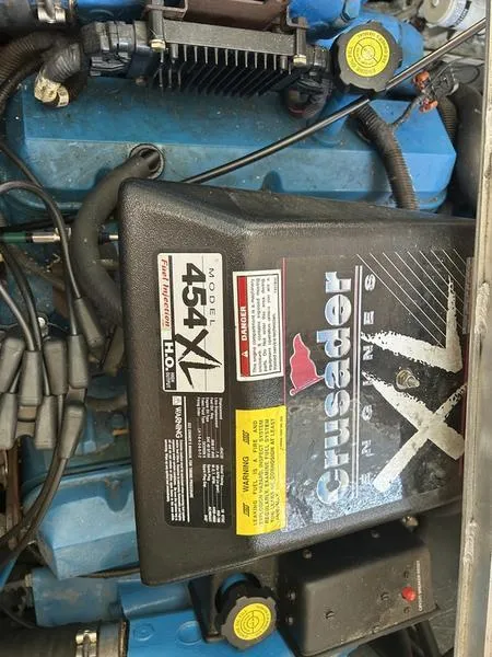 Slide: The Image of Engine of a 1997 Carver 400 CPMY with Crusader 454 XL model. - 2