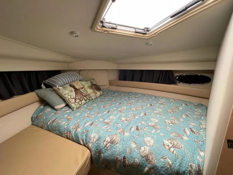 Slide: The Image of Cozy bedroom in 1997 Carver 400 CPMY yacht with nautical-themed bedding. - 25