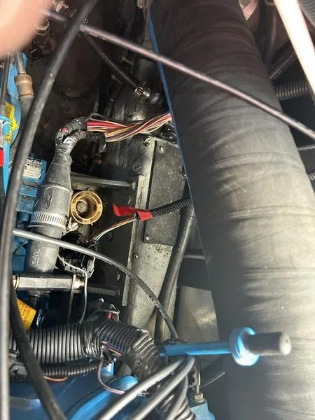 Slide: The Image of Engine compartment of a 1997 Carver 400 CPMY boat, showing wiring and hoses. - 33