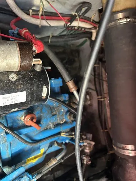 Slide: The Image of Engine compartment of a 1997 Carver 400 CPMY with visible wiring and components. - 38