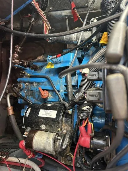 Slide: The Image of Engine compartment of a 1997 Carver 400 CPMY with visible wiring and components. - 41
