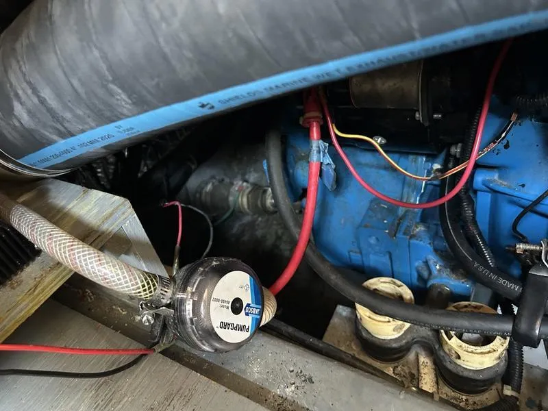 Slide: The Image of Engine compartment of a 1997 Carver 400 CPMY with visible wiring and components. - 43