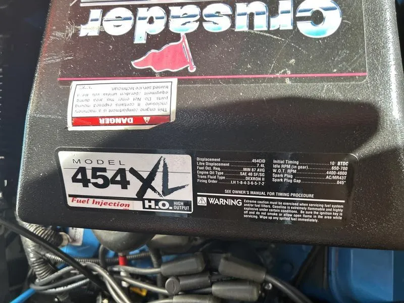 Slide: The Image of Engine cover of a 1997 Carver 400 CPMY with Model 454XL specifications. - 44