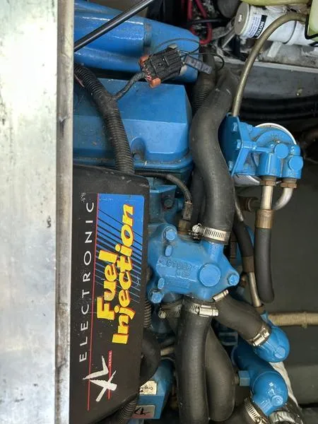 Slide: The Image of Engine compartment of a 1997 Carver 400 CPMY with electronic fuel injection system. - 49