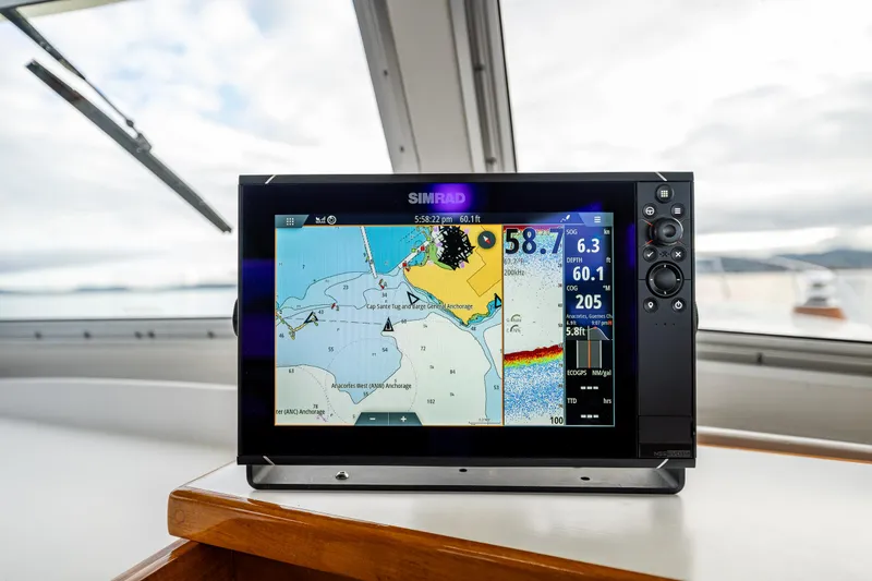 Slide: The Image of Boat navigation system displaying a digital map on a Rough Water 35, 1975 model. - 19