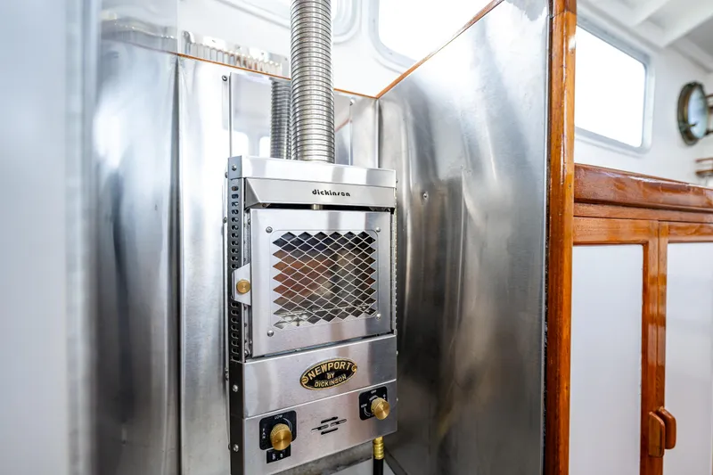 Slide: The Image of Vintage 1975 Rough Water 35 boat interior with stainless steel heater. - 24