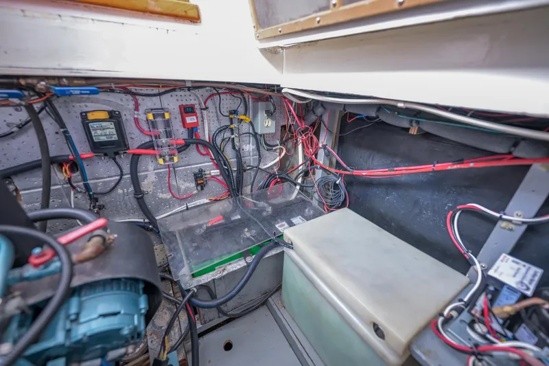 Slide: The Image of Electrical wiring and components inside a 1975 Rough Water 35 boat. - 35
