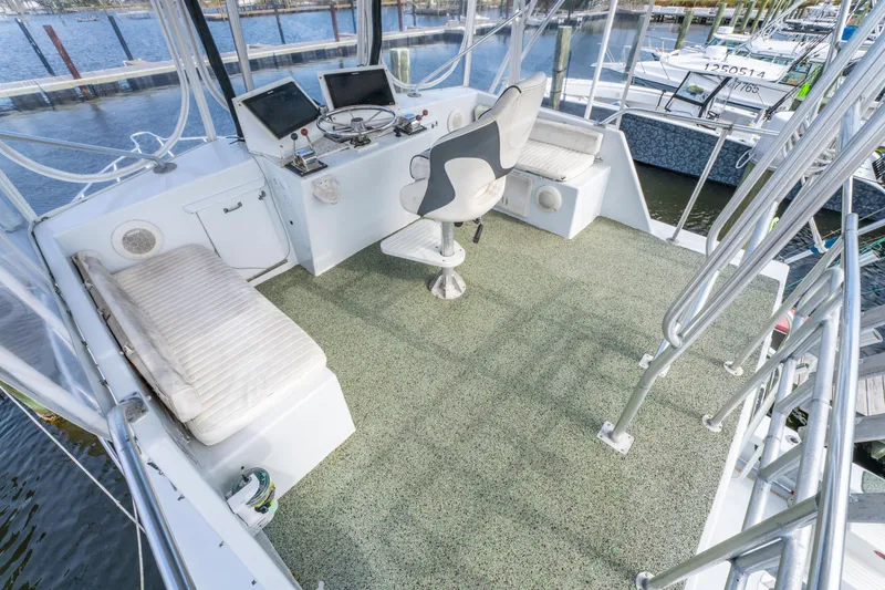 Slide: The Image of Cockpit of 1983 Resmondo 38 boat with helm, seating, and navigation equipment. - 17