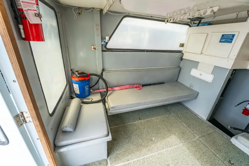 Slide: The Image of Interior of 1983 Resmondo 38 boat with seating and storage. - 22
