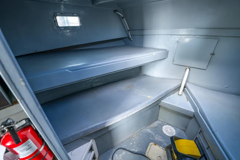 Slide: The Image of Interior cabin of 1983 Resmondo 38 boat with bunk beds and storage. - 27