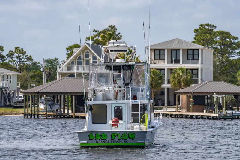 Slide: The Image of 1983 Resmondo 38 boat named "Bad Fish" docked in Orange Beach, AL. - 3