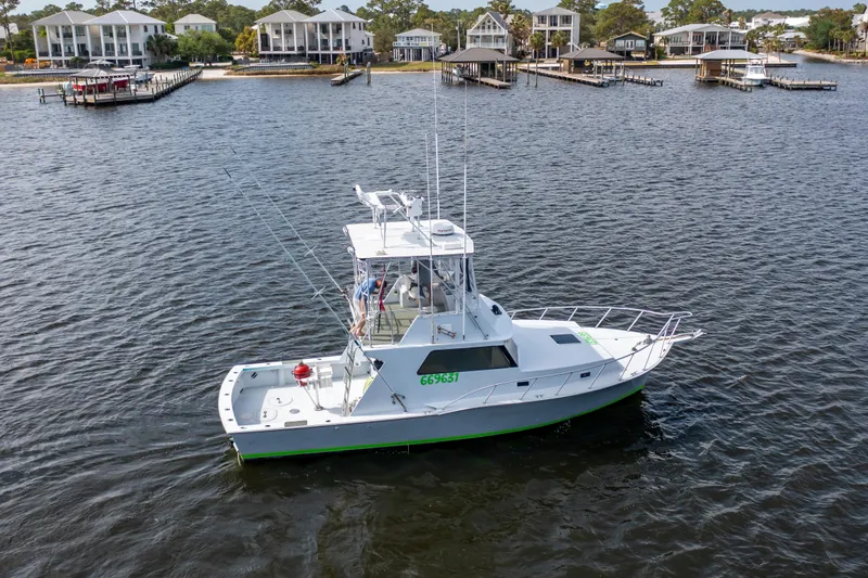 Slide: The Image of 1983 Resmondo 38 boat on water near waterfront homes. - 36