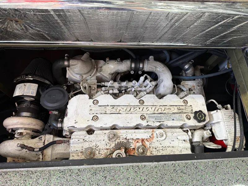 Slide: The Image of 1983 Resmondo 38 engine compartment featuring a Cummins marine engine. - 42