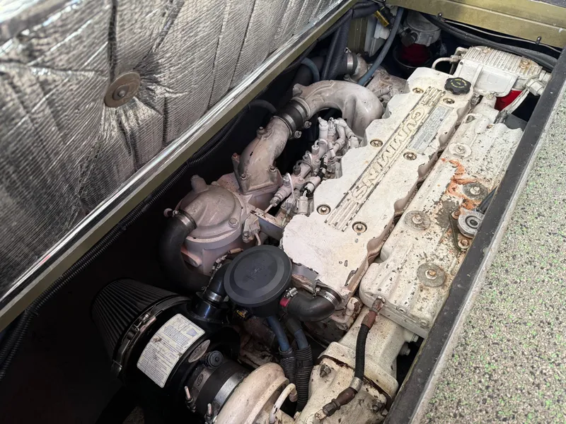 Slide: The Image of Engine compartment of a 1983 Resmondo 38, showcasing detailed mechanical components. - 43