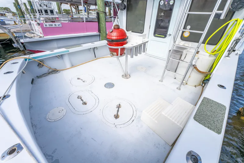 Slide: The Image of 1983 Resmondo 38 boat deck with hatches, ladder, and safety equipment. - 9