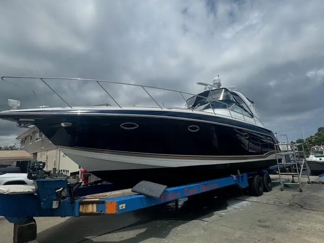 Slide: The Image of 2013 Formula 40pc yacht on trailer under cloudy sky. - 1