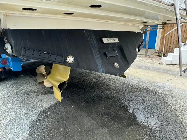 Slide: The Image of Rear view of a 2013 Formula 40pc boat showing propeller and hull details. - 14