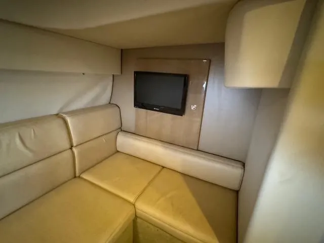 Slide: The Image of Interior of 2013 Formula 40pc yacht with beige seating and wall-mounted TV. - 2